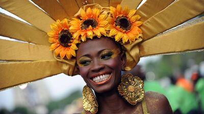 A queen of the Carnival of Flowers participates in the second day of the carnival on July 28, 2014 in Port-au-Prince. The three-day festival takes place through the streets of the Hatian capital’s downtown area. AFP