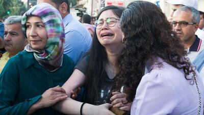 A supporter of the Mr Erdogan's ruling Justice and Development Party (AKP) reacts after the party's Istanbul mayoral candidate was defeated. Gurdan Ozturk / AFP