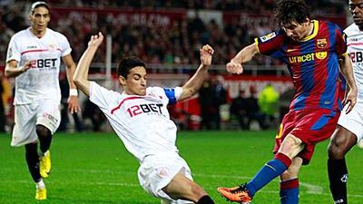 Barca's Lionel Messi, right, shoots before Sevilla's Jesus Navas can get in the way during the two Primera Liga club's 1-1 draw.