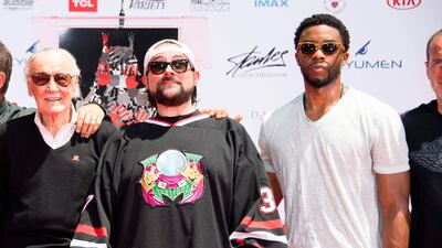 From left: Comic-book writer, editor, and publisher Stan Lee, and actors Kevin Smith and Chadwick Boseman attend Lee's hand and footprint ceremony at the TCL Chinese Theatre. Valerie Macon / AFP