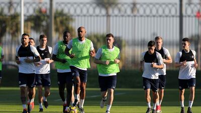 Vincent Kompany trains with his Manchester City teammates in Abu Dhabi on Thursday. Chris Whiteoak / The National