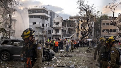 The site of an Iranian ballistic missile strike in Tel Aviv on Monday. Bloomberg