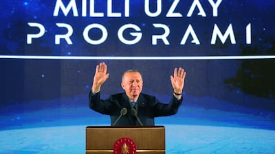 Turkish President Recep Tayyip Erdogan gestures during the National Space Program introductory meeting in Ankara, Turkey, on February 9, 2021. Erdogan said that Turkey's first contact with the Moon will take place in 2023, a Turkish citizen will be sent to space and the establishment of a spaceport is planned. Turkish President Press Office / EPA
