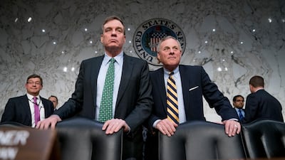 Senator Mark Warner, left, is the highest ranking Democrat on the Senate Intelligence Committee. Andrew Harnik / AP