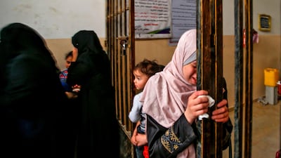 A relative mourns during the funeral of Maria al-Gazali, a four-month-old Palestinian baby, in Gaza City. AFP