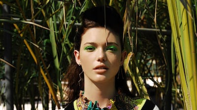 Nursery Rhyme: Sweater, Dh1,512, Elisabetta Franchi. Dress (worn underneath), Dh6,885, Etro. Earrings, from Dh2,340, Donna Hourani