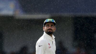 India captain Virat Kohli looks up as it starts to drizzle during the third day of their third and final Test against Sri Lanka in Colombo on Sunday. Dinuka Liyanawatte / Reuters / August 30, 2015