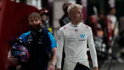 Williams driver Alexander Albon of Thailand walks in the pit lane after going out of the race. AP