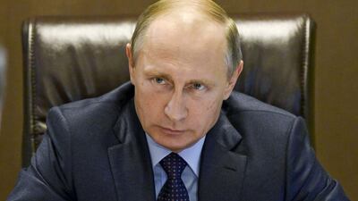 Russian president Vladimir Putin listens during a meeting at the presidential residence in the Russian Black Sea Resort of Sochi. Alexei Nikolsky / AP Photo