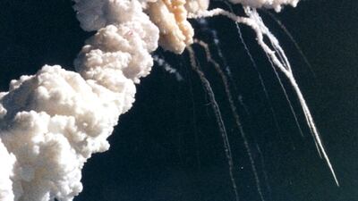 January 28, 1986. The Space Shuttle Challenger explodes 73 seconds after takeoff at Kennedy Space Centre, Florida. This picture shows the main engine exhaust, solid rocket booster plume and an expanding ball of gas from the external tank, visible seconds ???