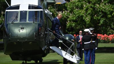 US President Donald Trump steps off Marine One to attend a welcome ceremony at Buckingham Palace in central London on June 3, 2019, on the first day of their three-day State Visit to the UK. Britain rolled out the red carpet for US President Donald Trump on June 3 as he arrived in Britain for a state visit already overshadowed by his outspoken remarks on Brexit. AFP