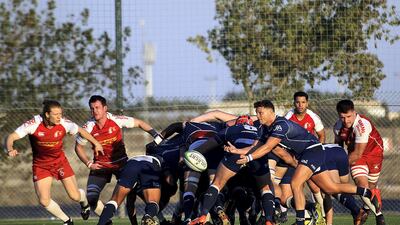 Jebel Ali Dragons, blue, and Bahrain in action during the West Asia Premiership match in Dubai. Satish Kumar for The National