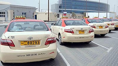 The new black-on-yellow plates are aimed at making it easier for riders to read taxis' numbers, officials say.