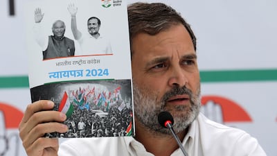 Indian National Congress senior leader Rahul Gandhi with a copy of the party's election manifesto, which it calls a 'document of justice'. EPA
