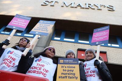 Healthcare workers on a picket line outside St Mary's Hospital in west London. AFP