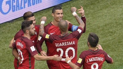 Cristiano Ronaldo, centre, celebrates after his penalty opened the scoring for Portugal against New Zealand. Olga Maltseva / AFP