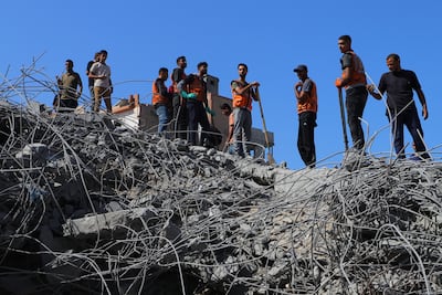 Gaza's civil defence members search bodies without heavy machinery and rescue equipment. Anadolu via AFP