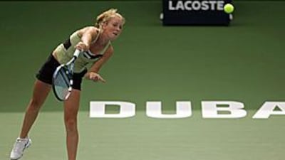 Poland's Urszula Radwanska returns the ball to her sister Agnieszka during their singles match on the second day of the Dubai Championships.