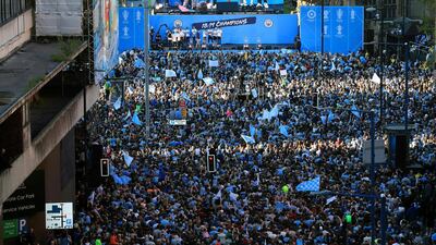 Manchester City players and staff on stage during the trophy parade in Manchester, England, after winning the FA Cup. Victory for Pep Guardiola’s side came a week after the English Premier League trophy was retained to join the League Cup and Community Shield already in City’s possession. AP Photo