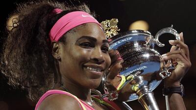 A delighted Serena Williams hugs the Australian Open trophy after defeating Maria Sharapova in the final. Bernat Armangue / AP