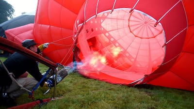 Hot air balloons take to the skies as they participate in the mass ascent at sunrise on the first day of the Bristol International Balloon Fiesta in Bristol, England. Getty Images