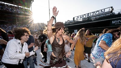 Grateful Dead fans, or Deadheads, dance during a Dead & Company concert. Photo Courtesy: Jay Blakesberg