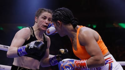 Amanda Serrano lands a right hand on Katie Taylor. Getty