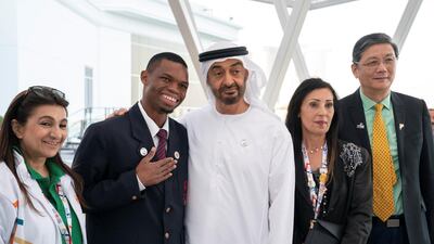 Sheikh Mohamed bin Zayed stands for a photograph with members of the Special Olympics Higher Committee during a Sea Palace barza.