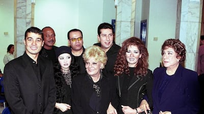 Nadia Lutfi (front and centre) with Khaled al-Nabawy, Talaat Zein, Hanan Turk, Khaled Agag, Hani Ramzi, Athar al-Hakim and Samiha Ayoub pose for a picture after performing a song dedicated to Palestinian people in October 2000. AFP