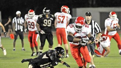 Dubai Stallions running back Davion Miller finds space during a run against the Abu Dhabi Wildcats on Friday night. Charles Crowell for The National / March 14, 2014