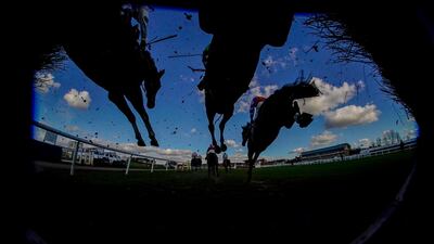 Runners clear a fence during the Watch On Racing TV Novices' Handicap Chase at Warwick Racecourse in England on Friday, February 26. Getty