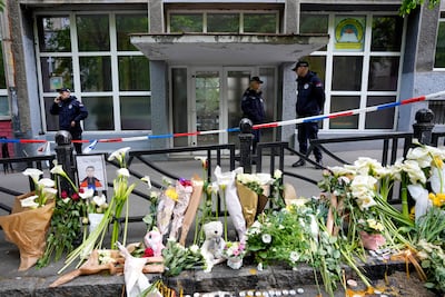 Police officers guard the Vladimir Ribnikar school in Belgrade, where a 13-year-old who opened fire and killed eight fellow pupils. AP