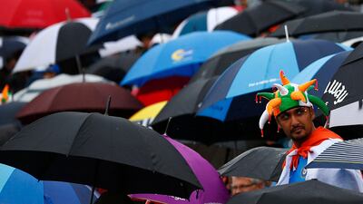The rain did return and with it the umbrellas went up again. This was fast turning into a damp squib. Darren Staples / Reuters