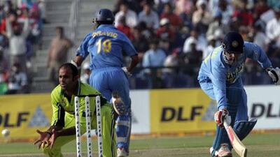 Rao Iftikhar, the Pakistan medium pacer, left, attempts to run India batsman Virender Sehwag, right, out during the DLF Cup in Abu Dhabi in 2006. The two teams could play in the capital if India agree on a series.