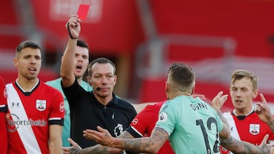 Everton's Lucas Digne, centre right, is shown a red card by the referee. AP