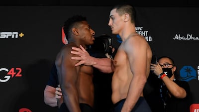 Joaquin Buckley and Alessio di Chirico of Italy face off during the UFC weigh-in at Etihad Arena on UFC Fight Island. Jeff Bottari / Zuffa LLC / Getty Images / UFC