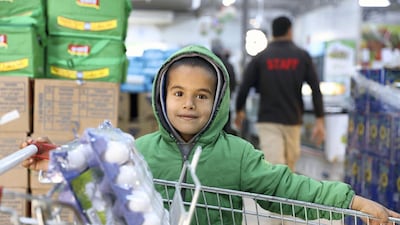 Young Syrian refugee boy in a World Food Programme-run supermarket in Zaatari refugee camp. All refugees in the camp receive monthly cash assistance from WFP, facilitated by the ‘Building Blocks’ blockchain system. Courtesy WFP / Mohammad Batah