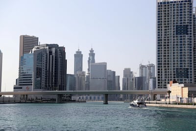 Shimmering waters and shiny skyscrapers make for a beautiful backdrop to city life for residents and visitors alike in Business Bay. Chris Whiteoak / The National