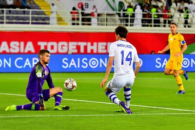 Australia's goalkeeper Mat Ryan, left, denies the Uzbekistan attack. AFP