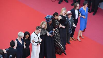 Last year female film personalities joined arms at one of the festival's premieres to protest the lack of female filmmakers honoured. They included, from left to right, Saudi filmmaker Haifaa al-Mansour, actors Kirsten Stewart and Lea Seydoux, singer Khadja Nin, filmmaker Ava DuVernay, actor Cate Blanchett and the late Agnes Varda. Getty Images
