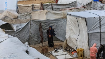 Displaced Palestinians among flimsy, makeshift shelters in a camp in Gaza city, where they are now vulnerable to a severe flu doing the rounds. Reuters