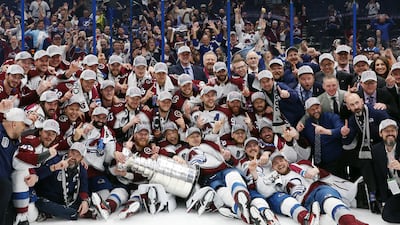 Colorado Avalanche coaches and players pose for a photo after defeating the Tampa Bay Lightning 2-1 in Game Six of the 2022 NHL Stanley Cup Final. AFP