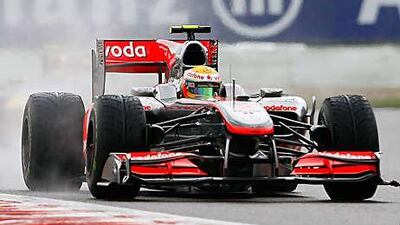 Lewis Hamilton drives his McLaren-Mercedes in the wet during yesterday's Belgium Grand Prix, which he won to give himself his third victory of the season.