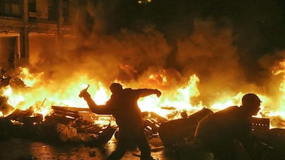 Protesters clash with riot police at Independence Square during protests in central Kiev, Ukraine. EPA