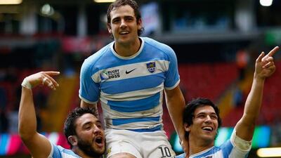 Nicolas Sanchez of Argentina is lifted on the shoulders of his teammates Lucas Noguera and Matias Moroni. Laurence Griffiths / Getty Images