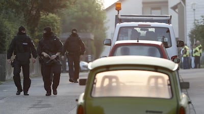 Special police officers secure a street near the house where a Syrian man lived before the explosion in Ansbach, southern Germany. AP Photo / Matthias Schrader