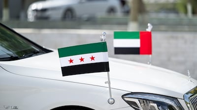 The UAE and Syrian flags displayed on a car for Mr Al Shara during a meeting at Al Shati Palace. Abdulla Al Bedwawi / UAE Presidential Court