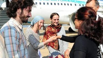 France's ambassador to Oman, Malika Berak, receives three French aid workers held hostage in Yemen since May upon their arrival in Muscat.