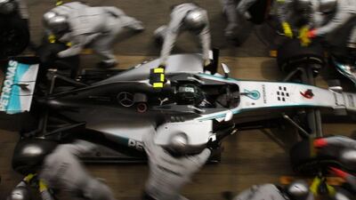 Mercedes driver Nico Rosberg gets a pit service during Sunday's Spanish Grand Prix. Emilio Morenatti / AP / May 11, 2014