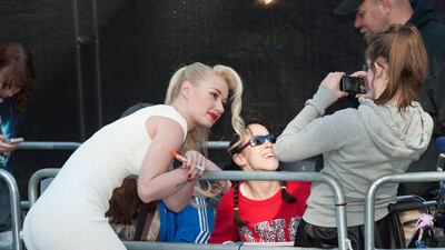 Australian singer Iggy Azalea poses for a photo with fans before the premiere of World War Z. Daniel Deme / EPA